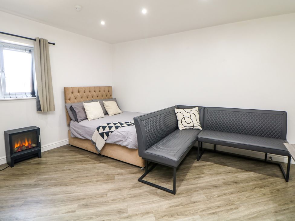 A bedroom with a bed and a couch at Don Valley Apartment A