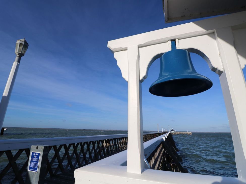 A pier with a bell and lamp post at Delaware M7 in Yarmouth