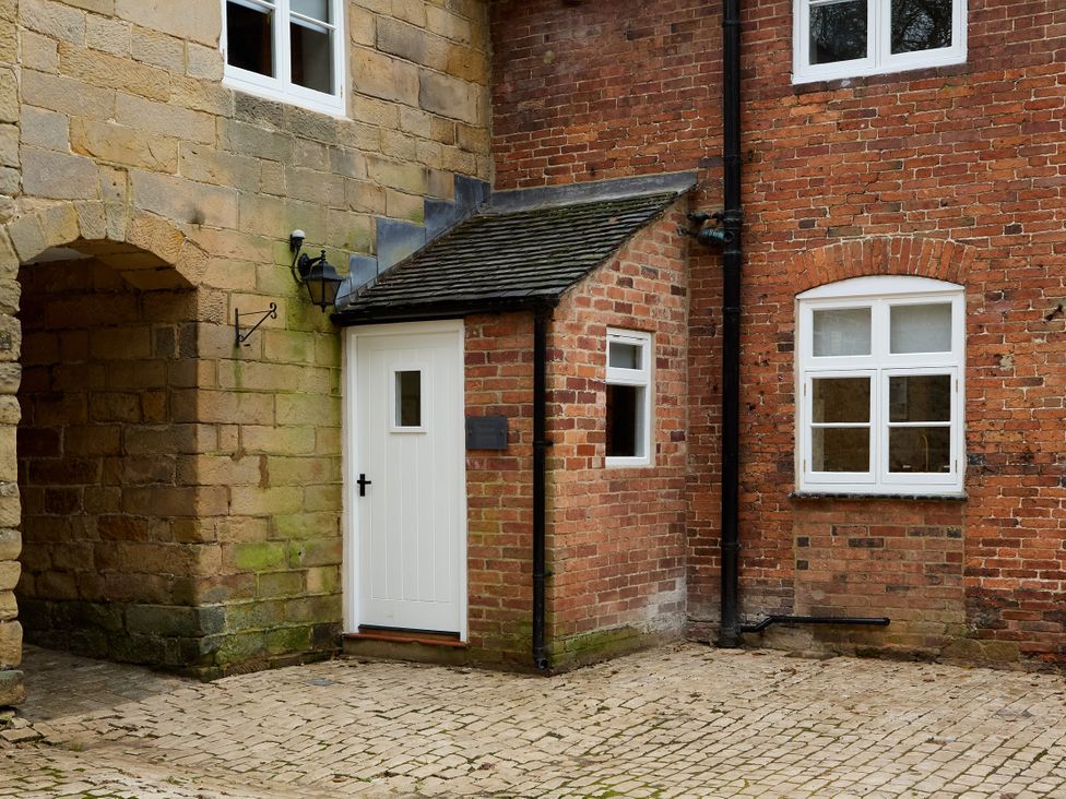 An exterior view of a doorway and windows at Butler's Quarters in Matlock