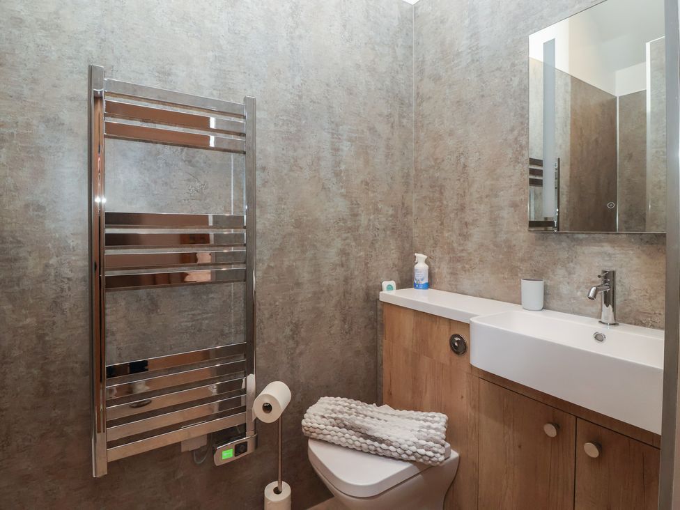 A bathroom with a sink and toilet at Stable End Cottage in York
