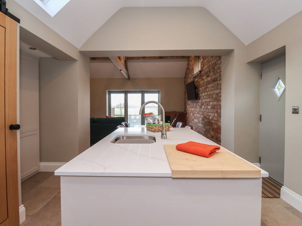 A kitchen with sink and countertop at Stable End Cottage Cuckoo Nest Farm near Wilberfoss