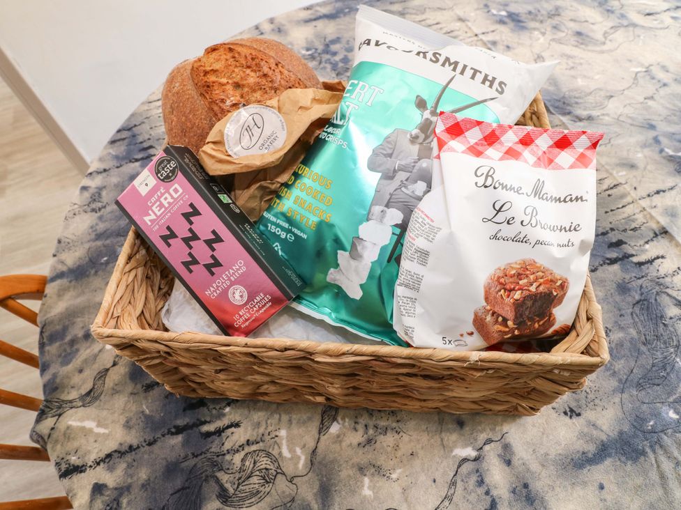 A basket with bread, coffee, snacks, and brownies at 83 Meeting Street in Quorn
