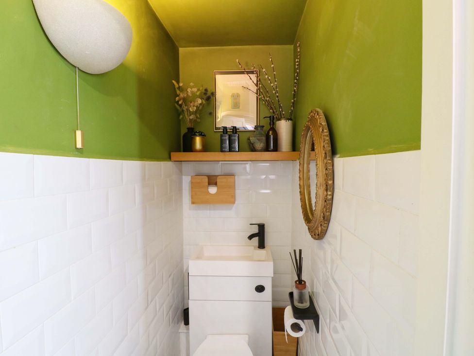 A bathroom with a sink and toilet at 83 Meeting Street in Quorn
