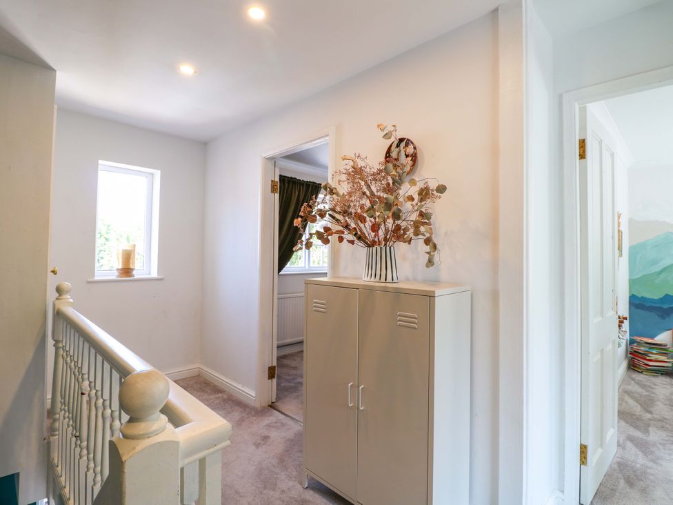 A hallway with a cabinet and windows at 83 Meeting Street in Quorn