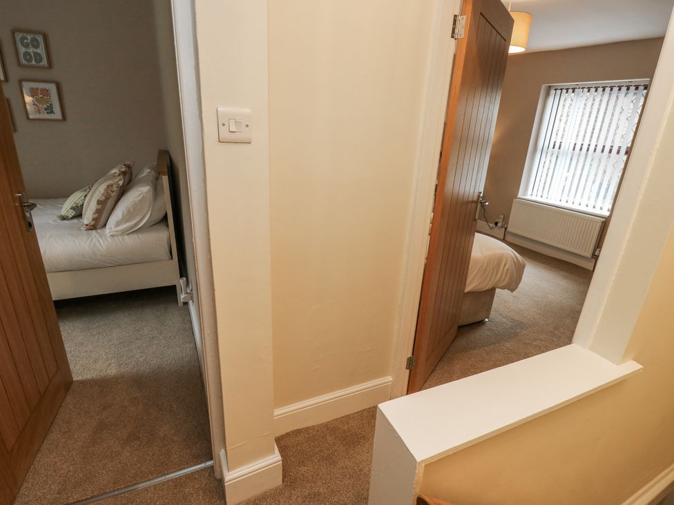 A hallway leading to bedrooms at Court Street Cottage Uppermill