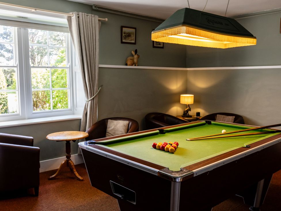A snug with a pool table and seating at Cheviot Manor near Wooler