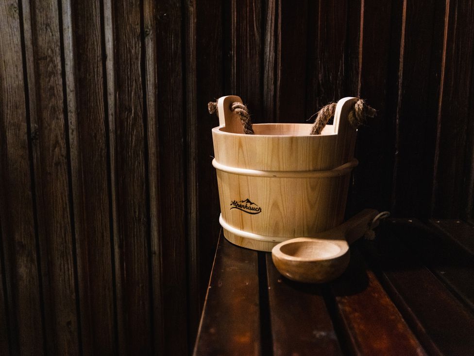 A wooden bucket and scoop in a spa area at Cheviot Manor Akeld near Wooler