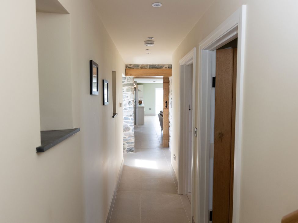A hallway with doors and frames at Golygfa Cwrt in Talybont