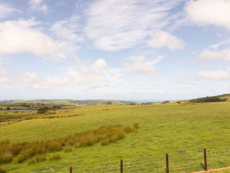 A landscape view of fields and hills at Golygfa Cwrt in Talybont