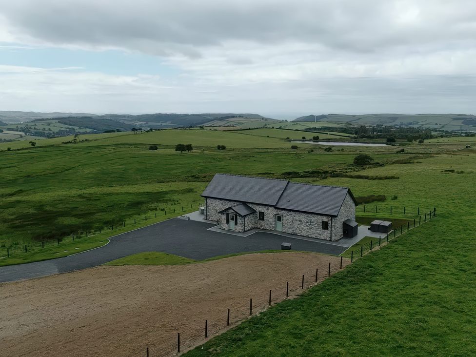 A stone house surrounded by fields near Bontgoch and Penrhyncoch
