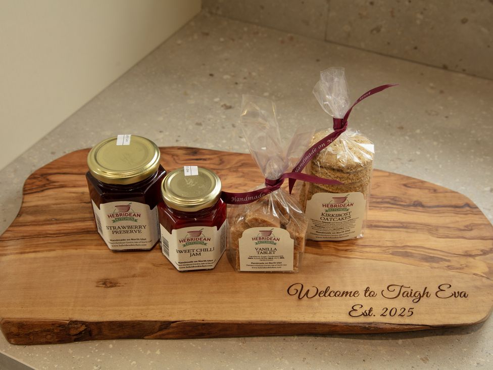 Jars of jam and oatcakes on a wooden platter at Taigh Eva near Lochmaddy