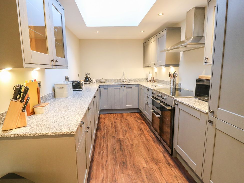 A kitchen with cabinets and countertop at Fogga Croft in Skipton