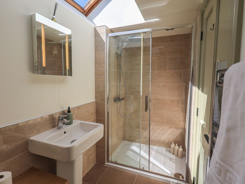 A bathroom featuring a shower and sink at Fogga Croft Gargrave