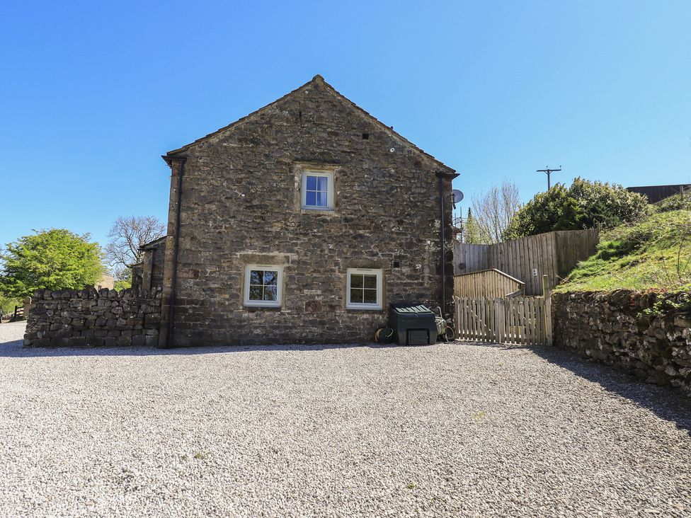 A stone house with windows and gate at Fogga Croft Gargrave