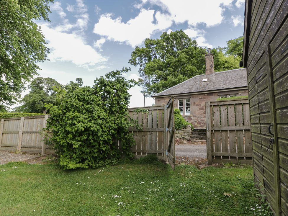 An outdoor view with a gate and a house at Eagle Glen Cottage Kettins near Coupar Angus