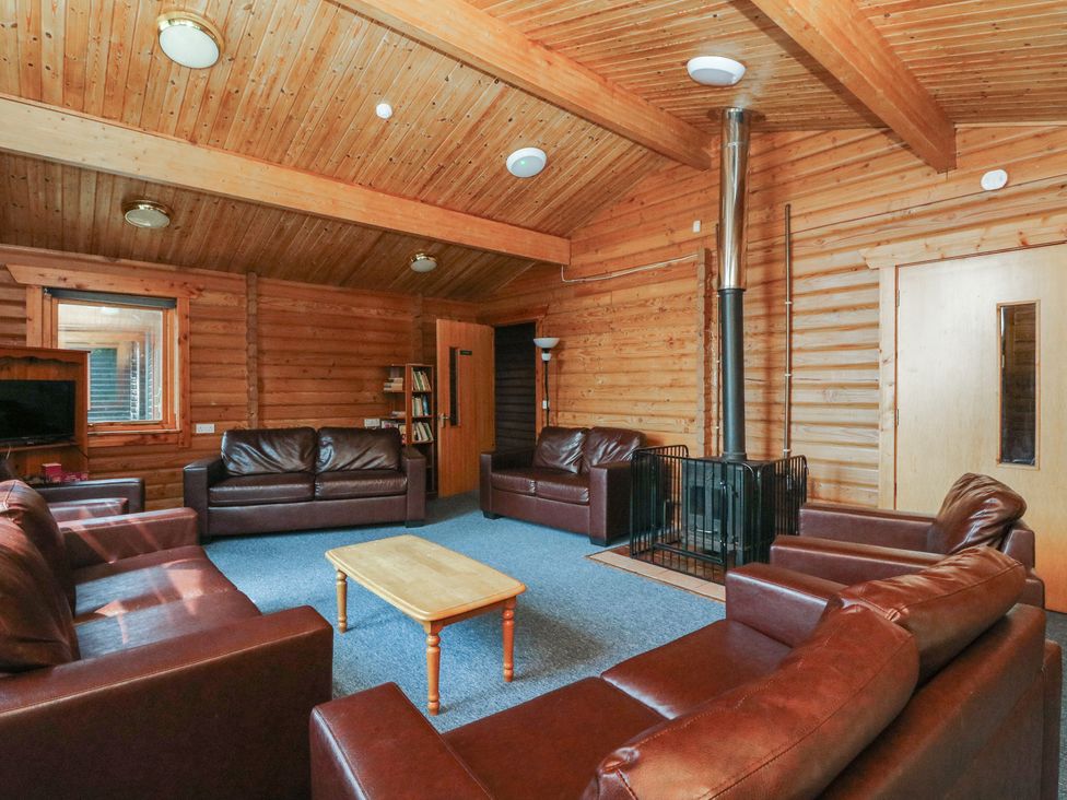 A living room with sofas and a coffee table at Shore Lodge in Brodick
