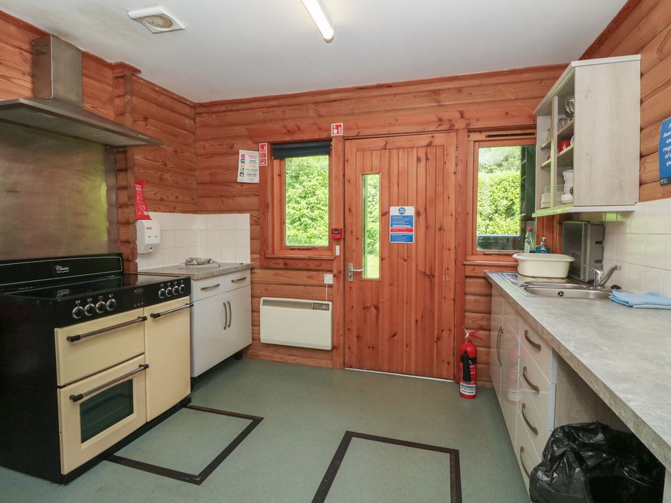 A kitchen with oven and sink at Shore Lodge in Brodick