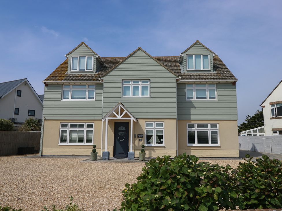 A house with multiple windows and an entrance path at 50 Sea Road Milford On Sea