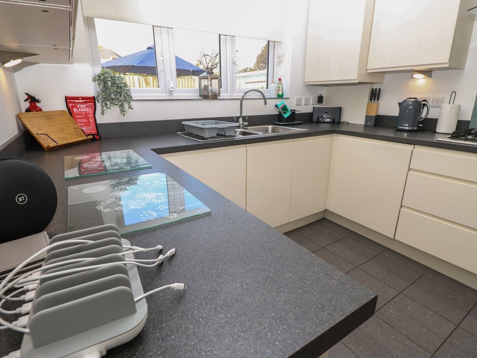 A kitchen with a sink and counter space at 50 Sea Road Milford On Sea
