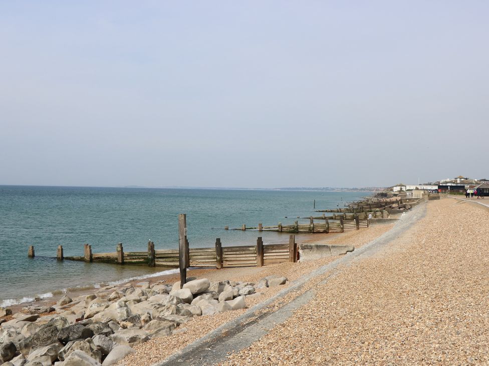 A beach with pebbles and groynes at 50 Sea Road Milford On Sea