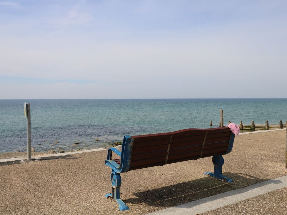 A bench overlooking the ocean at 50 Sea Road Milford On Sea