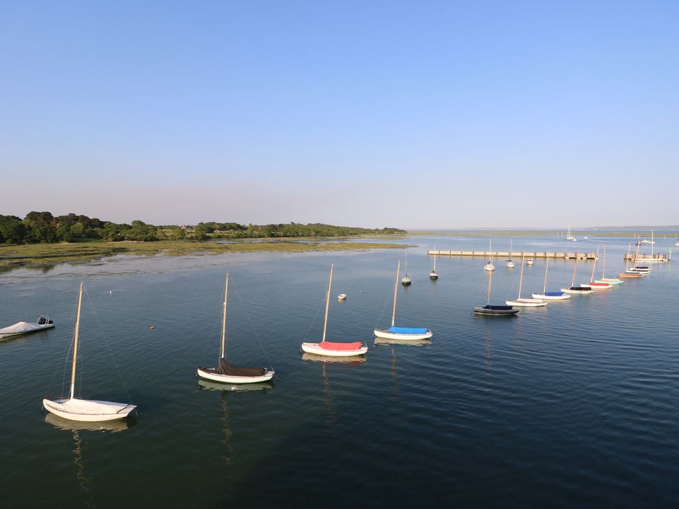 A view of sailboats on water near a pier at 50 Sea Road, Milford On Sea