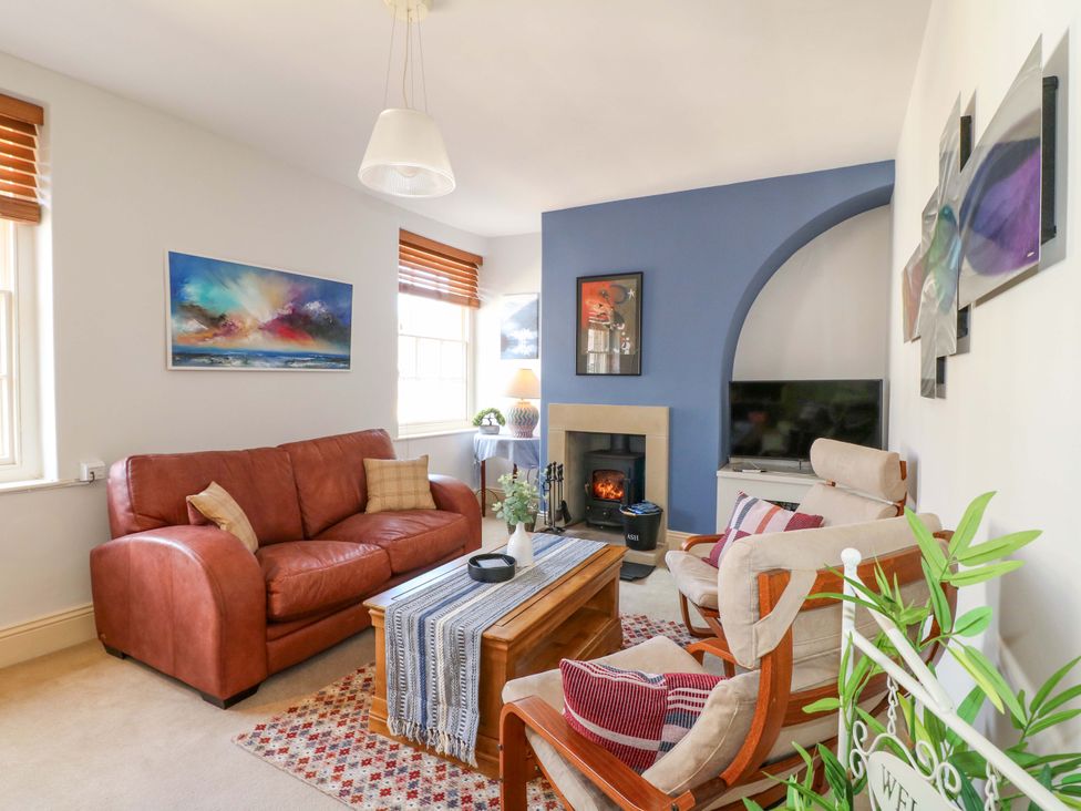 A living room with sofa and armchairs at 2A Water Street in Bakewell