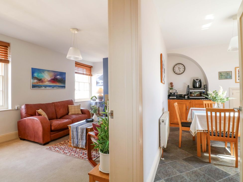A living room and dining area with furniture and appliances at 2A Water Street Bakewell
