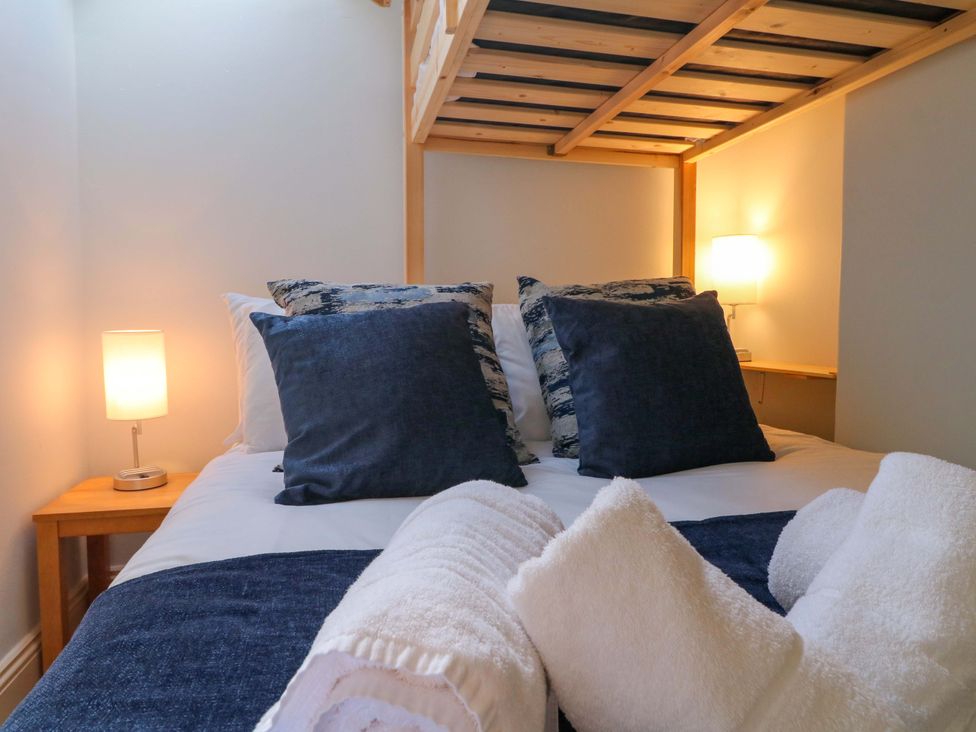 A bedroom with a bed and pillows at 2A Water Street in Bakewell