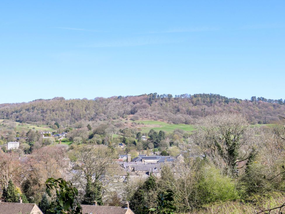A view of houses and trees with hills in the background at 2A Water Street Bakewell