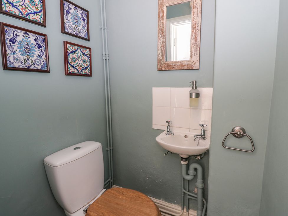 A bathroom with a toilet and sink at Ty Clyd Newport, Pembrokeshire