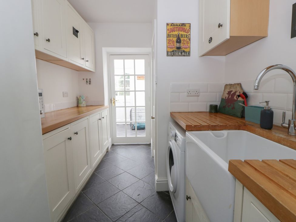 A kitchen with cabinets and a sink at Ty Clyd in Newport, Pembrokeshire