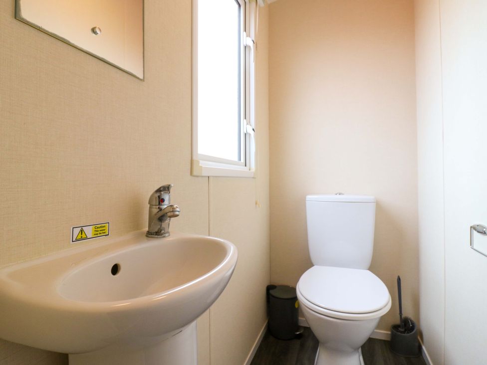 A bathroom with a sink and toilet at Meadowside