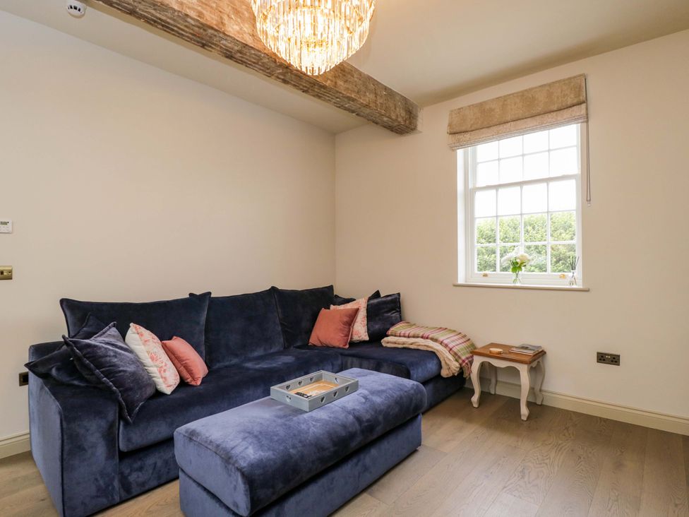 A living room with a sofa and window at Beech in Newbury