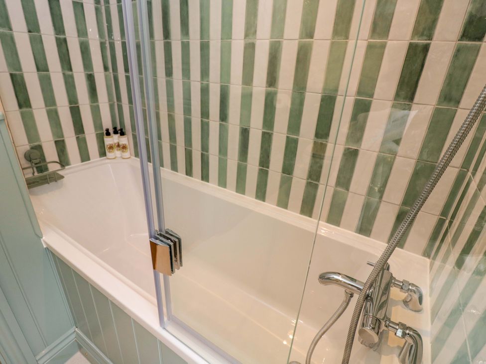 A bathroom with a bathtub and shower at Beech in Newbury