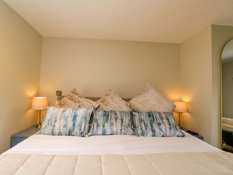 A bedroom with a bed and decorative pillows at Beech in Newbury