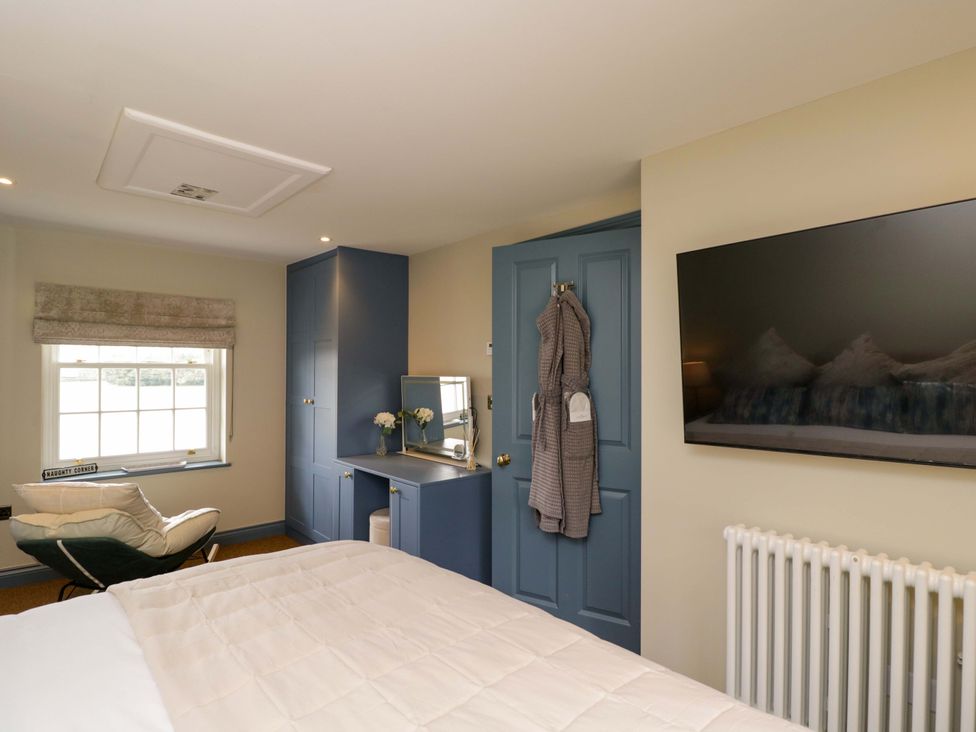 A bedroom with a bed and television at Beech in Newbury