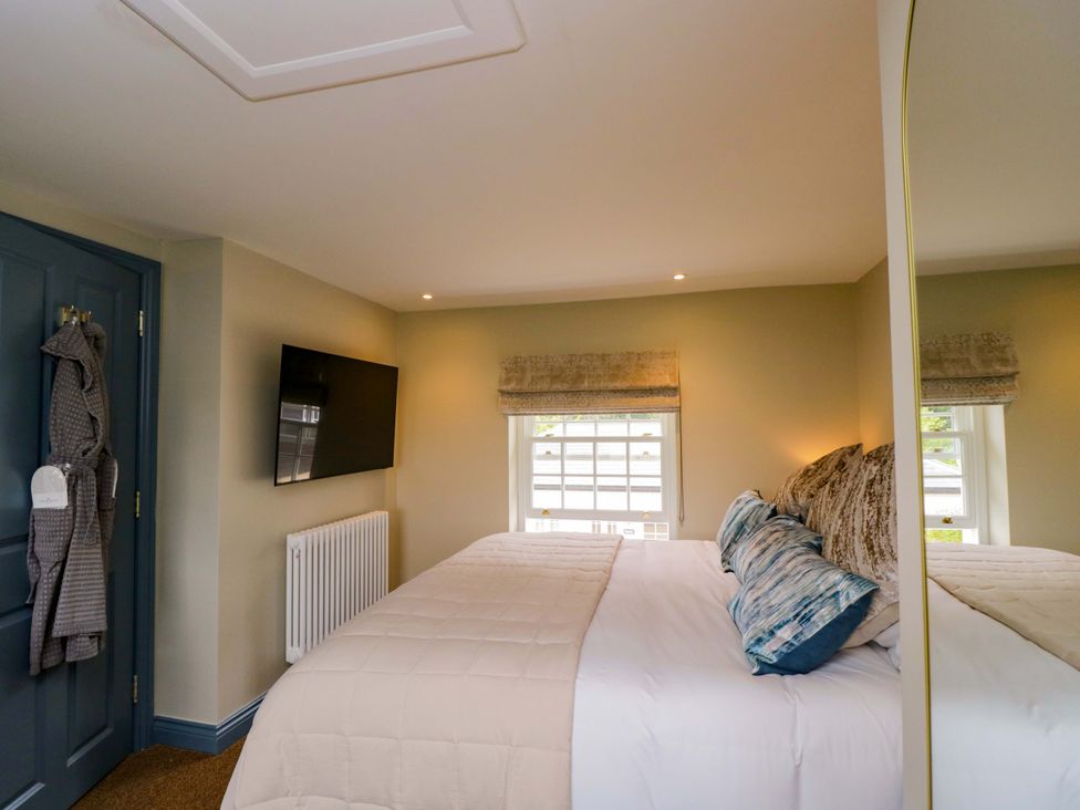 A bedroom with a bed and television at Beech in Newbury