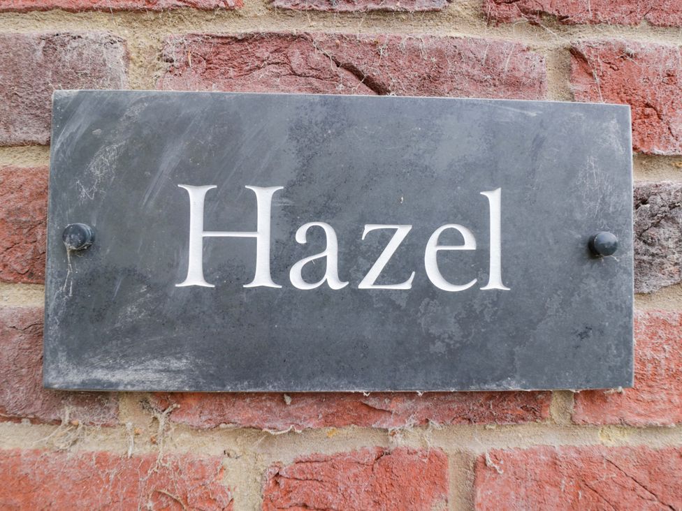 A plaque with the name Hazel on a brick wall at Hazel Elcot near Kintbury