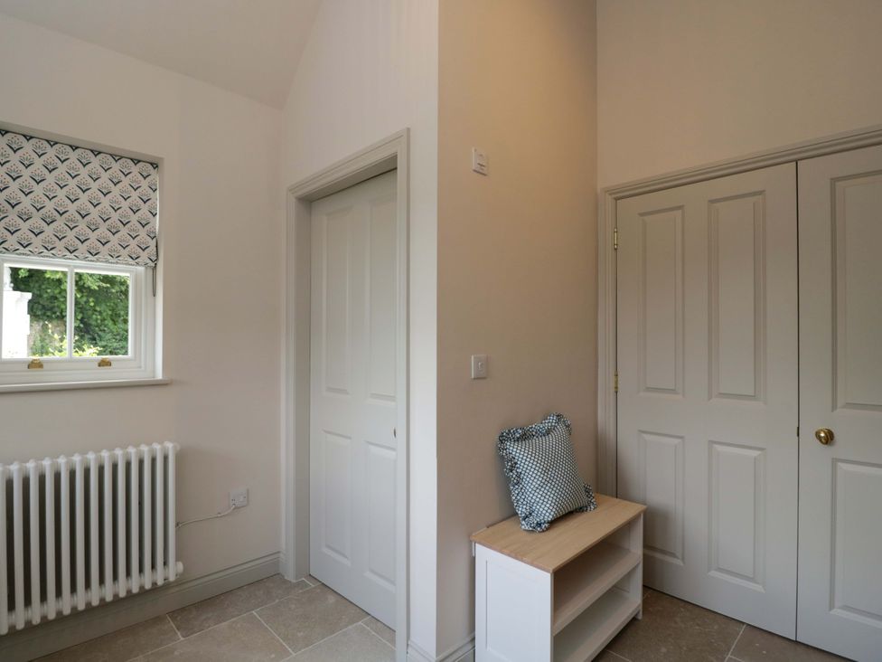 A hallway with a window and a shelf at Hazel in Elcot near Kintbury
