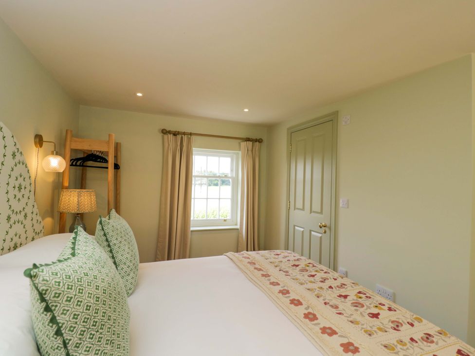 A bedroom with a bed and window at Hazel Elcot near Kintbury