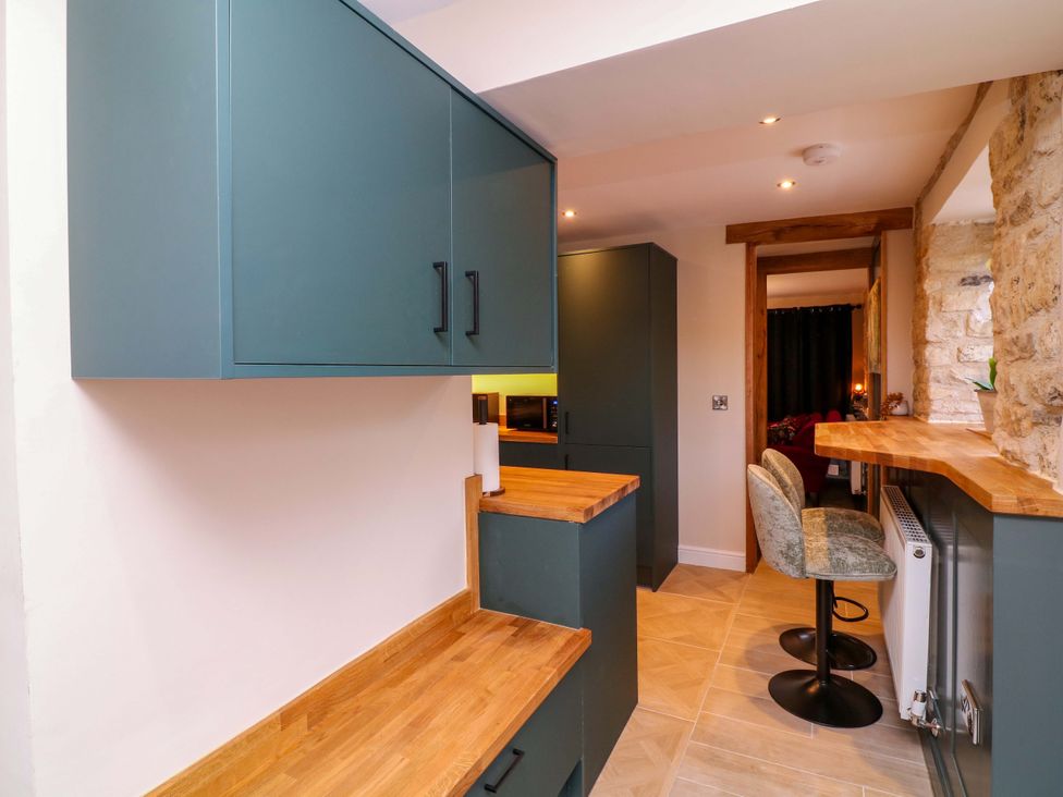 A kitchen with cabinets and a countertop at 7 The Row in Grantham