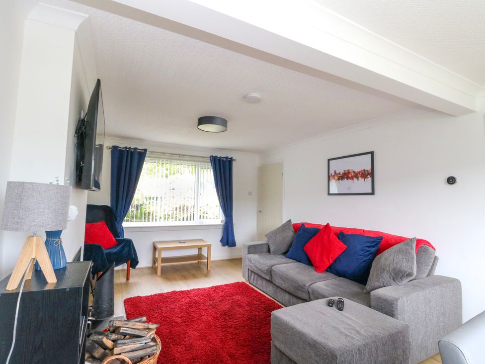 A living room with a sofa and coffee table at 3 Whin Bank Clachan-Seil near Balvicar Isle Of Seil