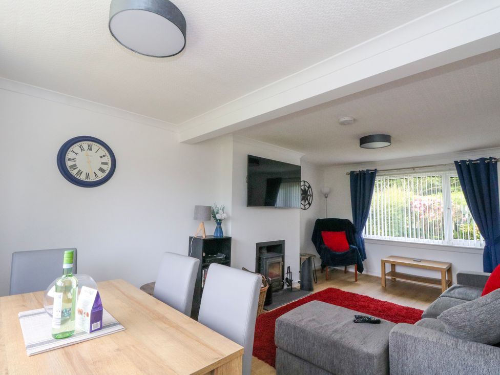 A living room with a table and chairs at 3 Whin Bank Clachan-Seil near Balvicar Isle Of Seil