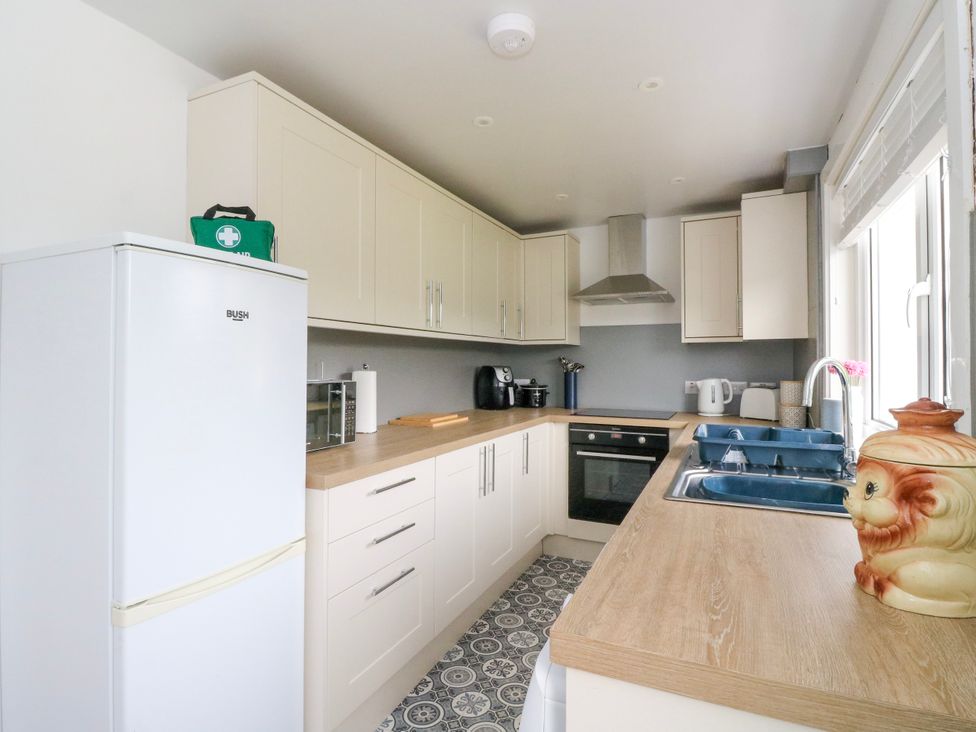 A kitchen with appliances and a countertop at 3 Whin Bank Clachan-Seil near Balvicar Isle Of Seil