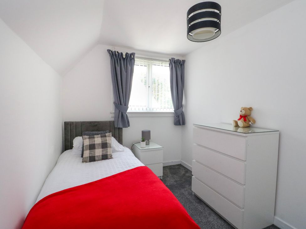 A bedroom with a bed and a dresser at 3 Whin Bank Clachan-Seil near Balvicar, Isle Of Seil