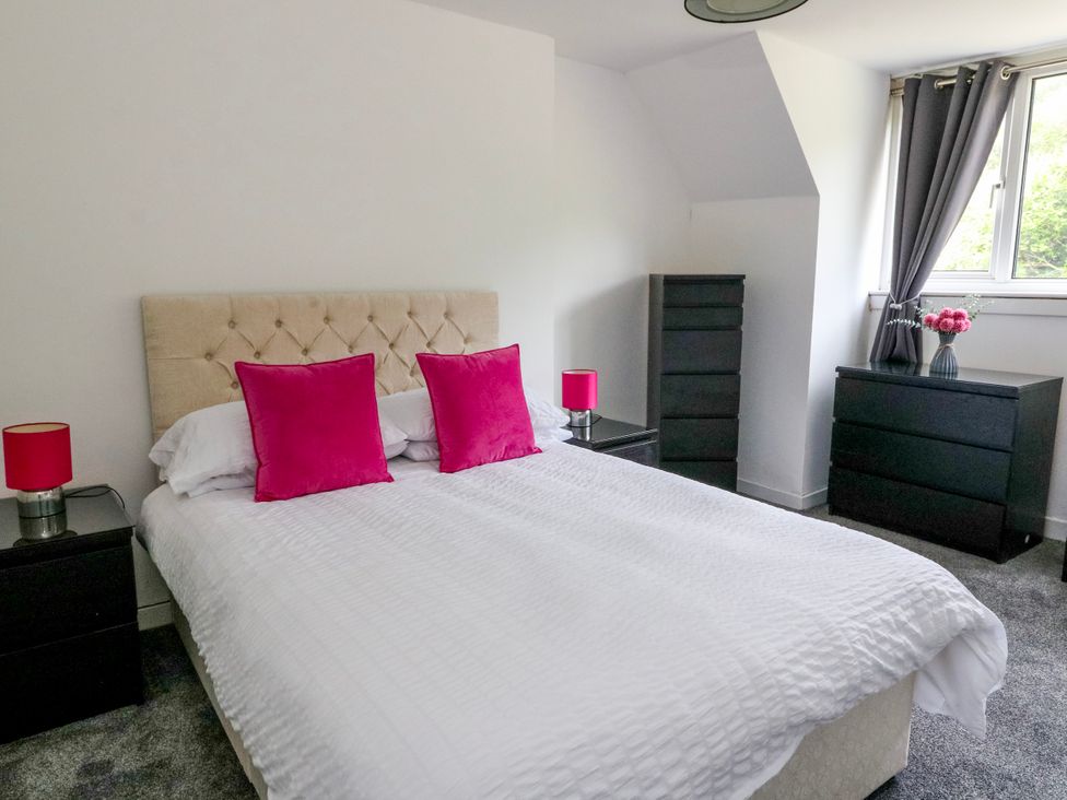 A bedroom with a bed and bedside tables at 3 Whin Bank Clachan-Seil near Balvicar Isle Of Seil