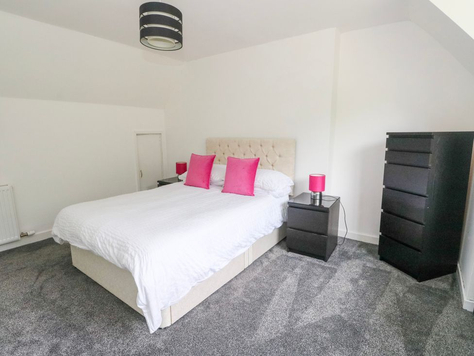A bedroom with a bed and bedside tables at 3 Whin Bank Clachan-Seil near Balvicar Isle Of Seil