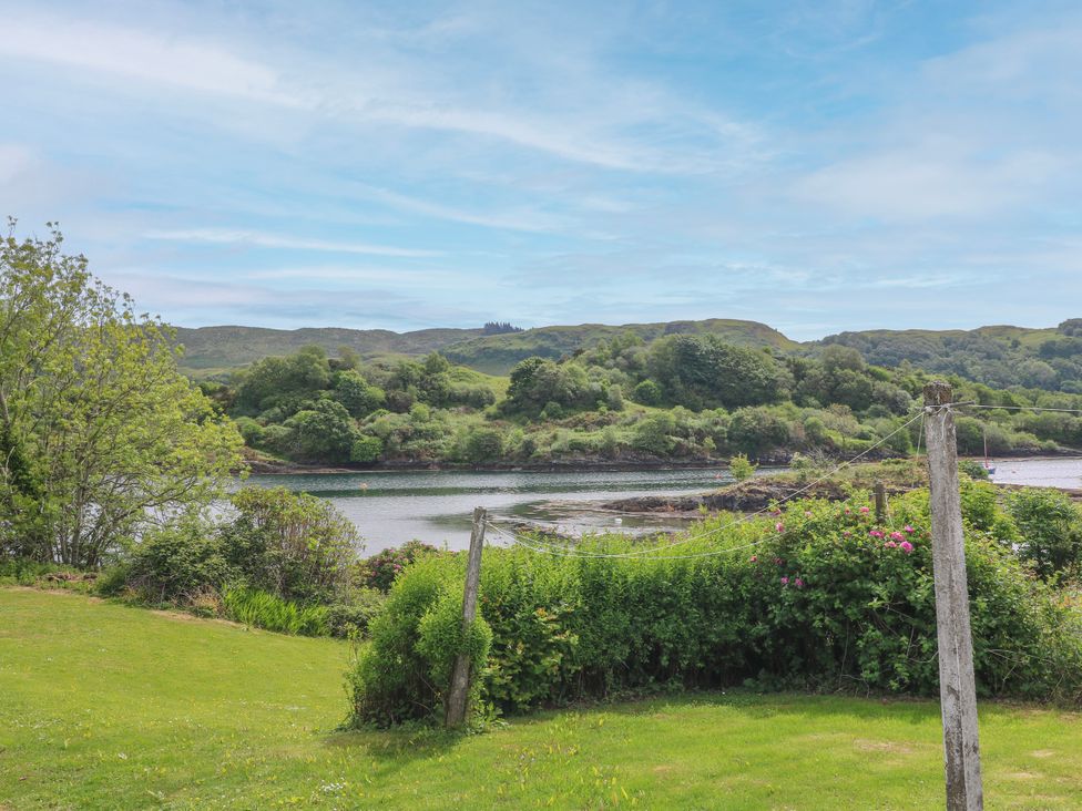 A view of a river and hills from a garden at 3 Whin Bank, Clachan-Seil near Balvicar, Isle Of Seil
