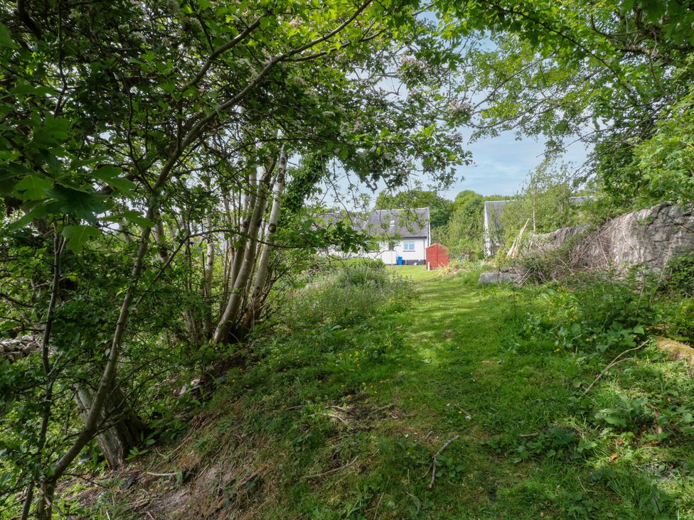 A path leading to a house with a shed at 3 Whin Bank Clachan-Seil near Balvicar Isle Of Seil